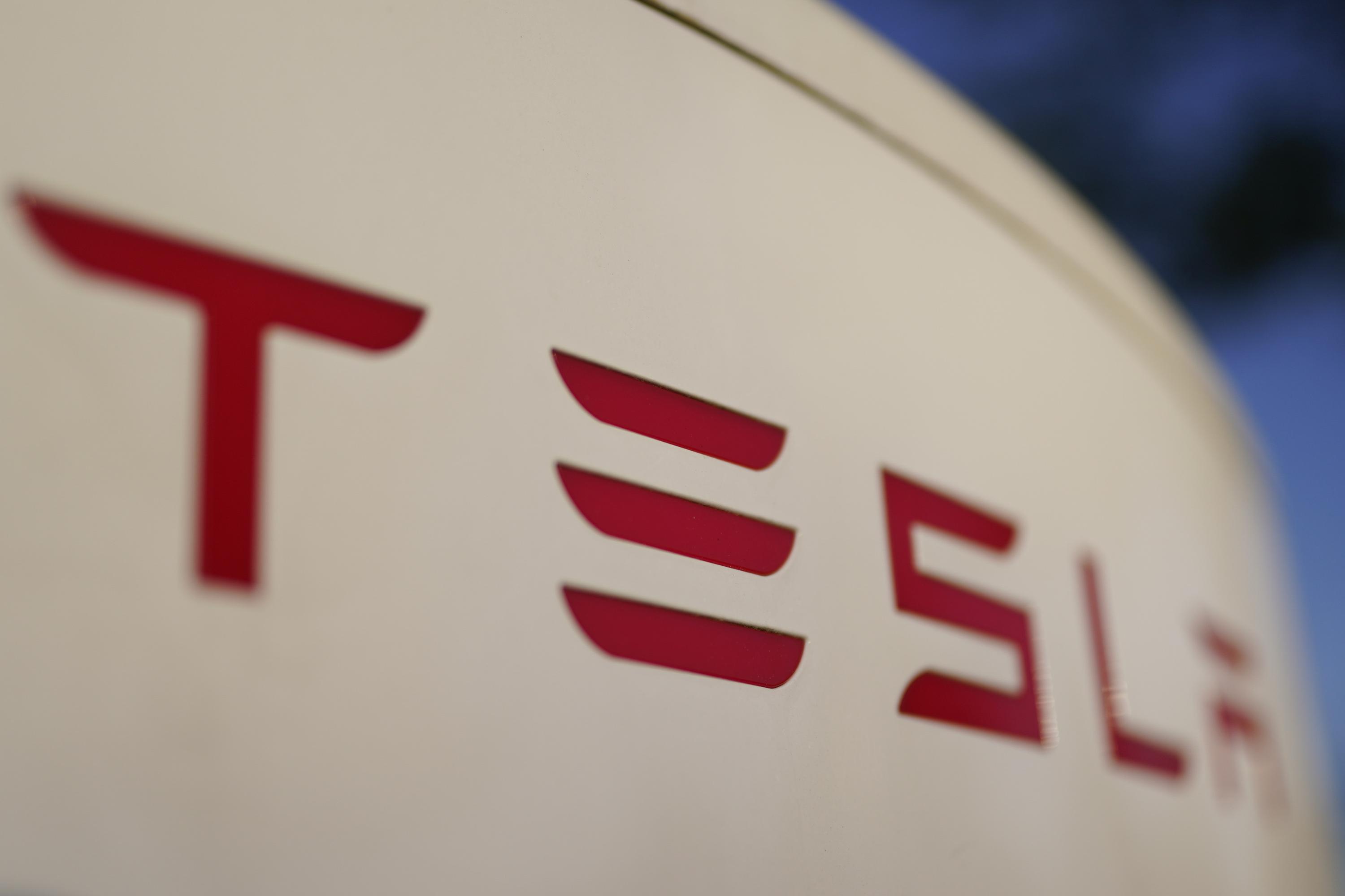 Tesla 2Q profit falls from 1Q, but is stronger than expected AP News