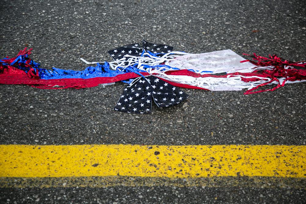 Uneasy US tries to fete a July 4 marred by parade shooting