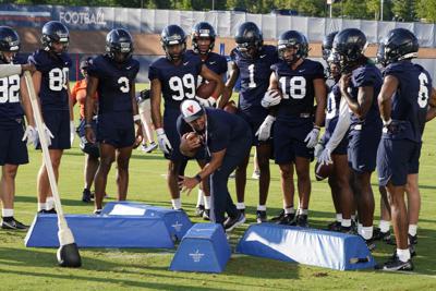 New Virginia coach Tony Elliott building around talented QB | AP News