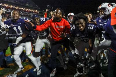 Resurgent Auburn rides Cadillac into Iron Bowl — once again | AP News