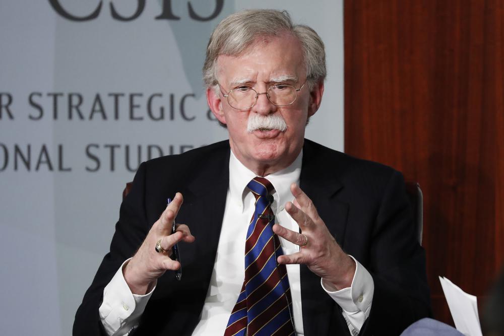 FILE - Former National security adviser John Bolton gestures while speaking at the Center for Strategic and International Studies (CSIS) in Washington, Sept. 30, 2019. The Justice Department says an Iranian operative has been charged in a plot to murder former Trump administration national security John Bolton.  (AP Photo/Pablo Martinez Monsivais, File)