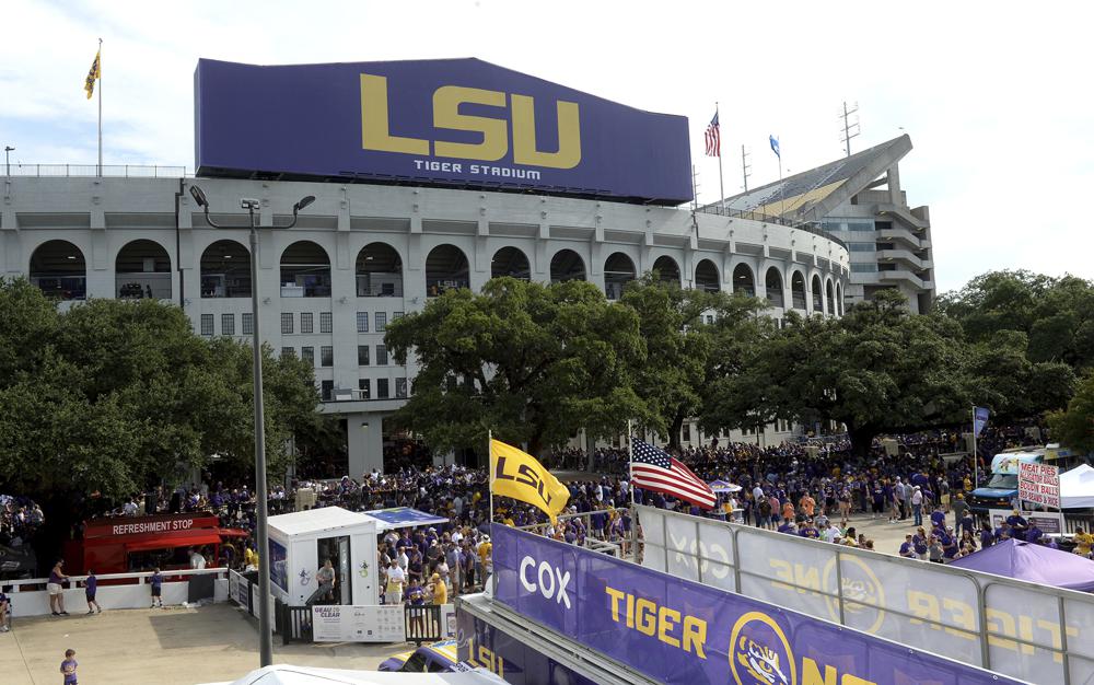 FILE - In this Sept. 14, 2019, file photo, preparations are made outside Tiger Stadium before an NCAA football game between LSU and Northwestern State in Baton Rouge, La. LSU and Caesar's Sportsbook announced Friday, Sept. 17, 2021, that they have entered into a multi-year sponsorship agreement, making Louisiana's flagship state university the first in the Southeastern Conference to enter a financial partnership with a gambling company. (AP Photo/Patrick Dennis, File)