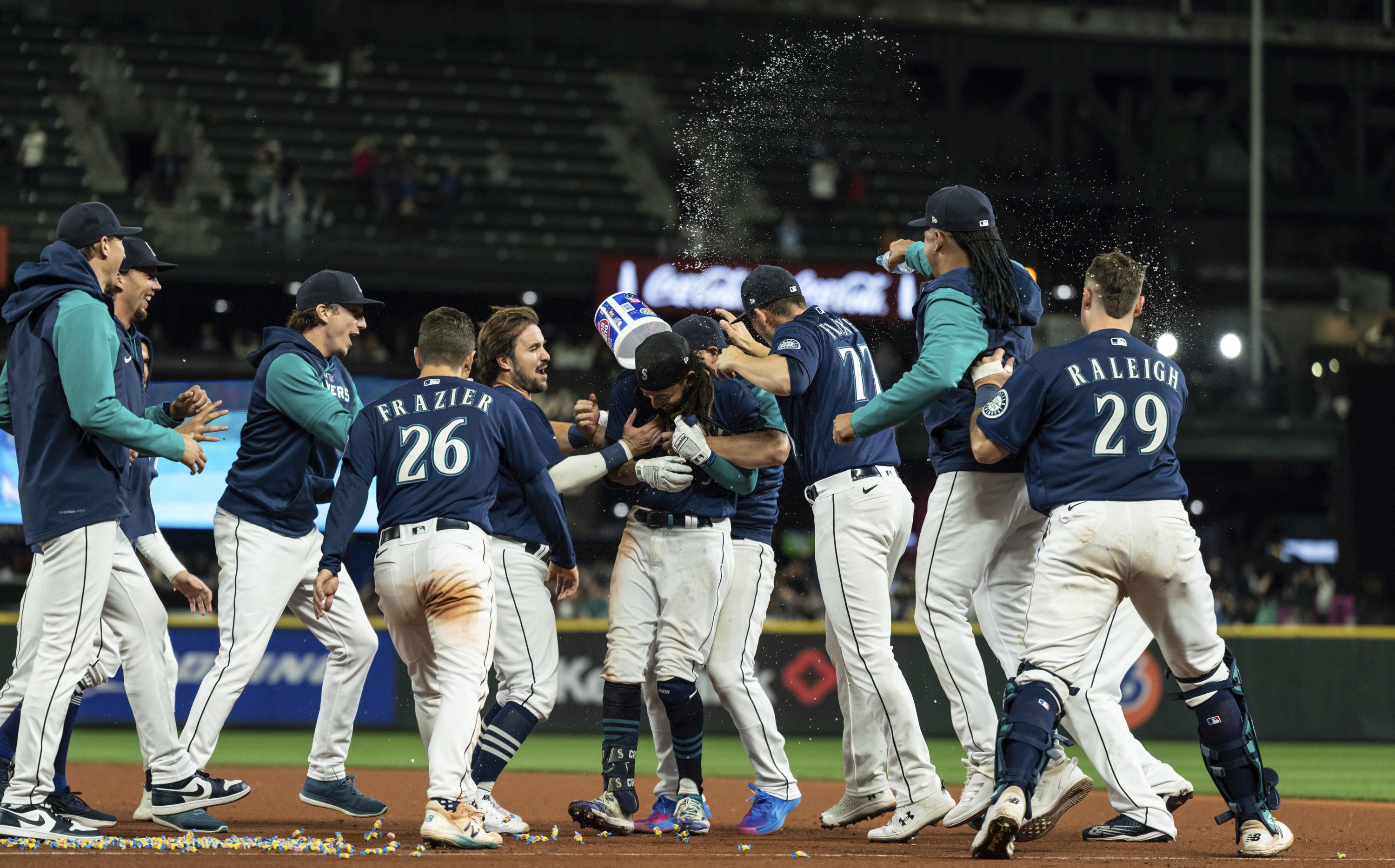 Mariners outlast Rangers in 11, close in on playoff berth AP News