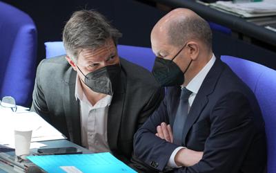 German Economy and Climate Minister Robert Habeck, left, and German Chancellor Olaf Scholz, right, attend a budget debate as part of a meeting of the German federal parliament, Bundestag, at the Reichstag building in Berlin, Germany, Wednesday, March 23, 2022. (Michael Kappeler/dpa via AP)