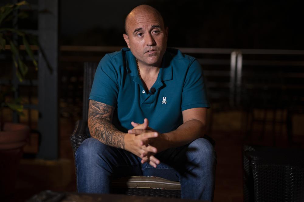 Jose Irizarry, a once-standout DEA agent sentenced to more than 12 years in federal prison for conspiring to launder money with a Colombian cartel, speaks during an interview the night before going to a federal detention center, in San Juan, Puerto Rico, Wednesday, Jan. 5, 2022. “You can’t win an unwinnable war. DEA knows this and the agents know this,” Irizarry says. “There’s so much dope leaving Colombia. And there’s so much money. We know we’re not making a difference.” (AP Photo/Carlos Giusti)