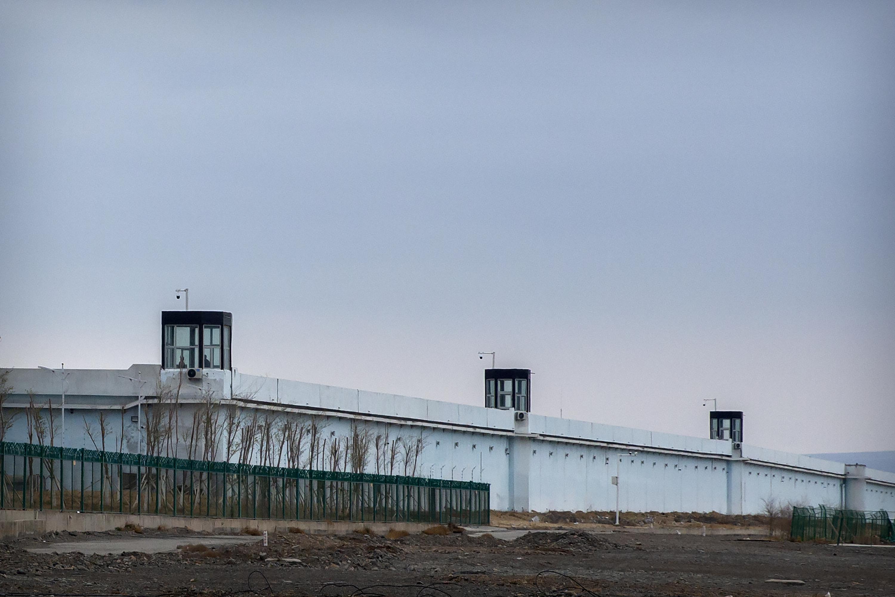 DABANCHENG, China (AP) — The Uyghur inmates sat in uniform rows with their legs crossed in lotus position and their backs ramrod straight, numbered 