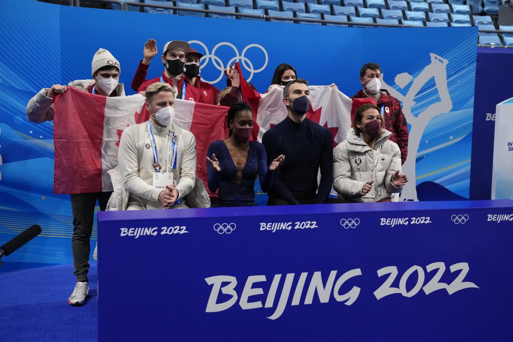 FILE - Vanessa James and Eric Radford, of Canada, react after the pairs team free skate program during the figure skating competition at the 2022 Winter Olympics, Feb. 7, 2022, in Beijing. In a century-old sport that had been largely European until just a few decades ago, some still wonder how more Black athletes can make a lasting imprint on competitive figure skating.  “If you don’t see yourself in the sport, how can you believe that you belong, how can you believe that you can be the best, how do you know that you can be creative or that you’ll be accepted for your uniqueness?” James said. (AP Photo/Natacha Pisarenko, File)