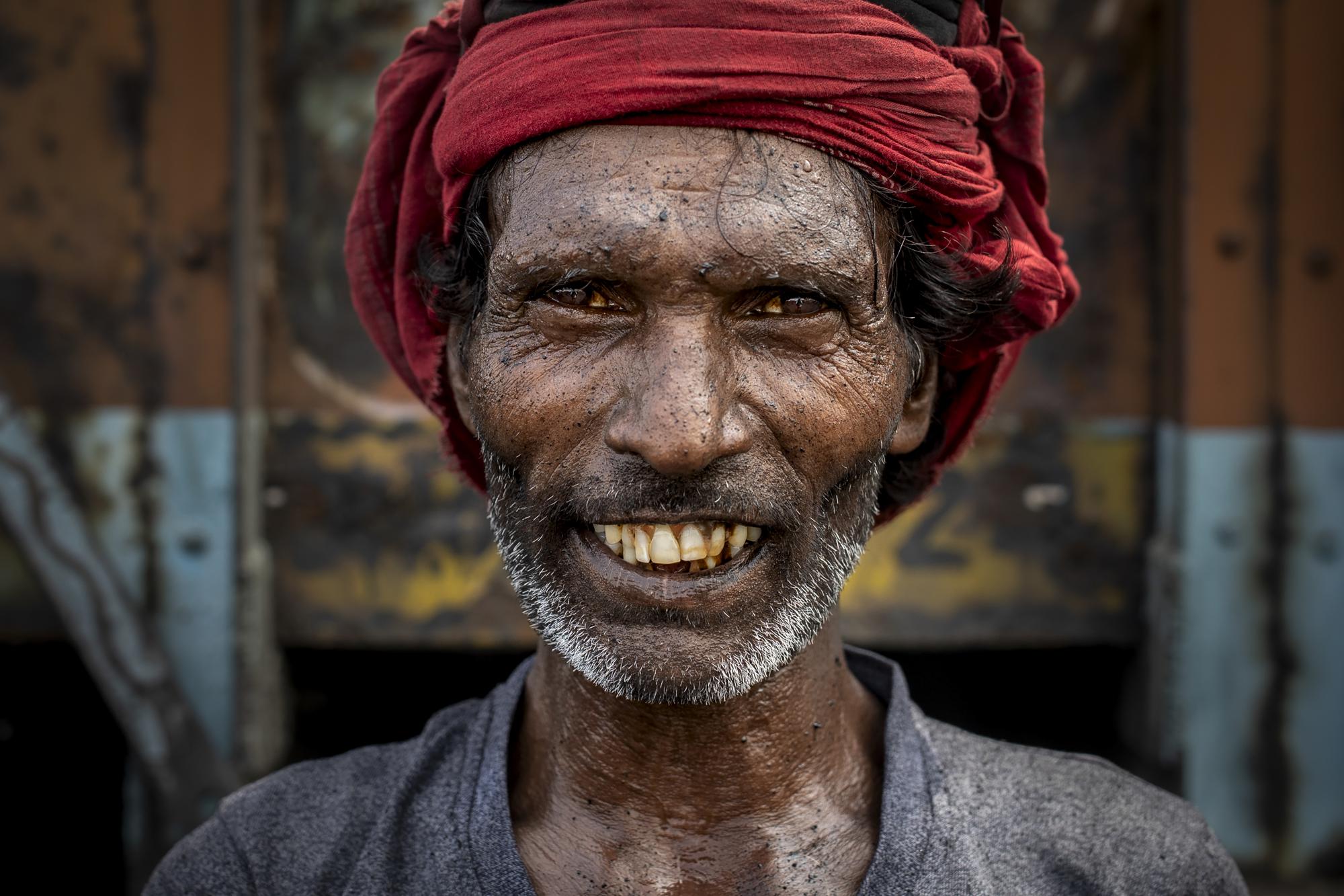 A laborer poses for a photograph while taking a break from loading coal into a truck in Dhanbad, an eastern Indian city in Jharkhand state, Friday, Sept. 24, 2021. A 2021 Indian government study found that Jharkhand state -- among the poorest in India and the state with the nation’s largest coal reserves -- is also the most vulnerable Indian state to climate change. Efforts to fight climate change are being held back in part because coal, the biggest single source of climate-changing gases, provides cheap electricity and supports millions of jobs. It's one of the dilemmas facing world leaders gathered in Glasgow, Scotland this week in an attempt to stave off the worst effects of climate change. (AP Photo/Altaf Qadri)