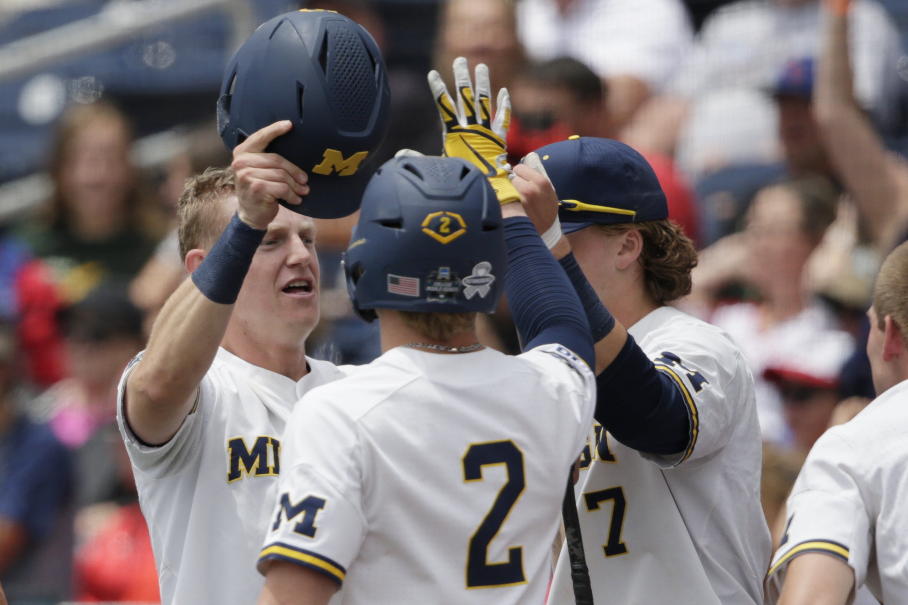 Michigan makes CWS finals with 153 win over Texas Tech AP News