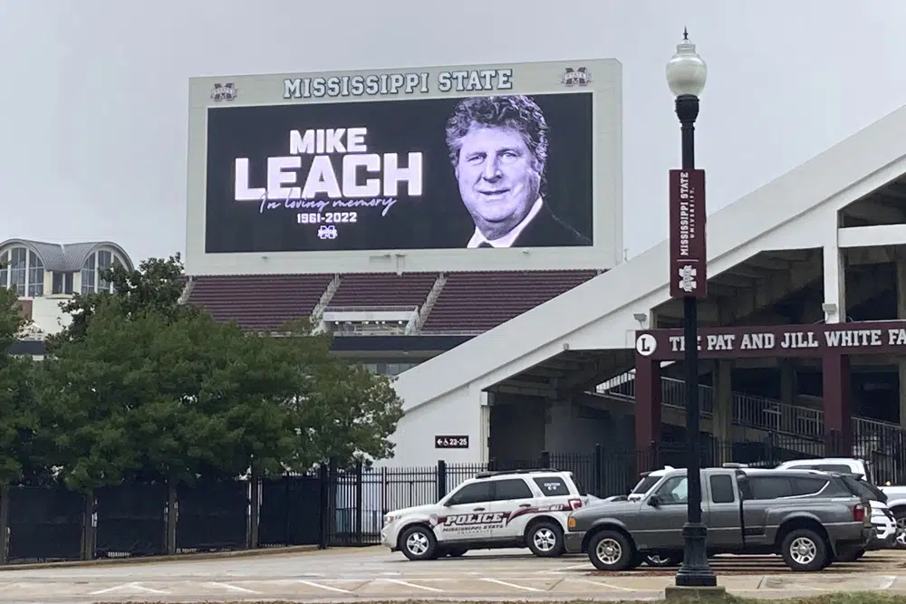 The video board at Davis Wade Stadium displays a message in memory of Mississippi State NCAA college football coach Mike Leach, Tuesday, Dec. 13, 2022, in Starkville, Miss. Leach, 61, died Monday night, Dec. 12, at the University of Mississippi Medical Center in Jackson following complications from a heart condition, the university announced. (Theo DeRosa/The Commercial Dispatch, via AP)