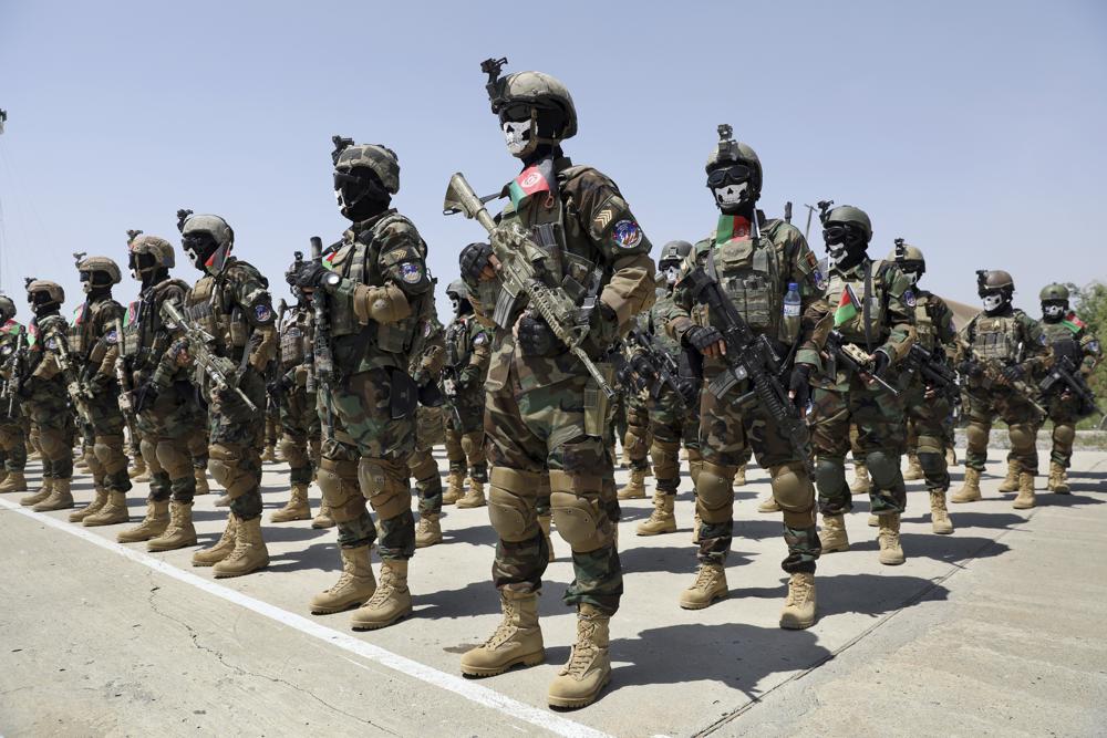 FILE - New Afghan Army special forces members attend their graduation ceremony after a three-month training program at the Kabul Military Training Center (KMTC) in Kabul, Afghanistan, Saturday, July 17, 2021. Afghan special forces soldiers who fought alongside American troops and then fled to Iran after the chaotic U.S. withdrawal last year are now being recruited by the Russian military to fight in Ukraine, three former Afghan generals told The Associated Press. (AP Photo/Rahmat Gul, File)