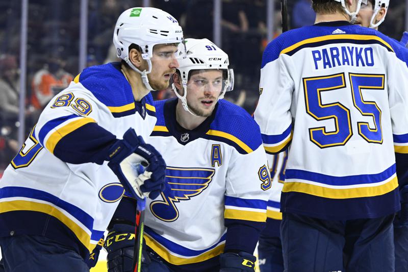 St. Louis Blues' Vladimir Tarasenko, center, is congratulated by teammates after scoring against the Philadelphia Flyers during the third period of an NHL hockey game Tuesday, Feb. 22, 2022, in Philadelphia. (AP Photo/Derik Hamilton)