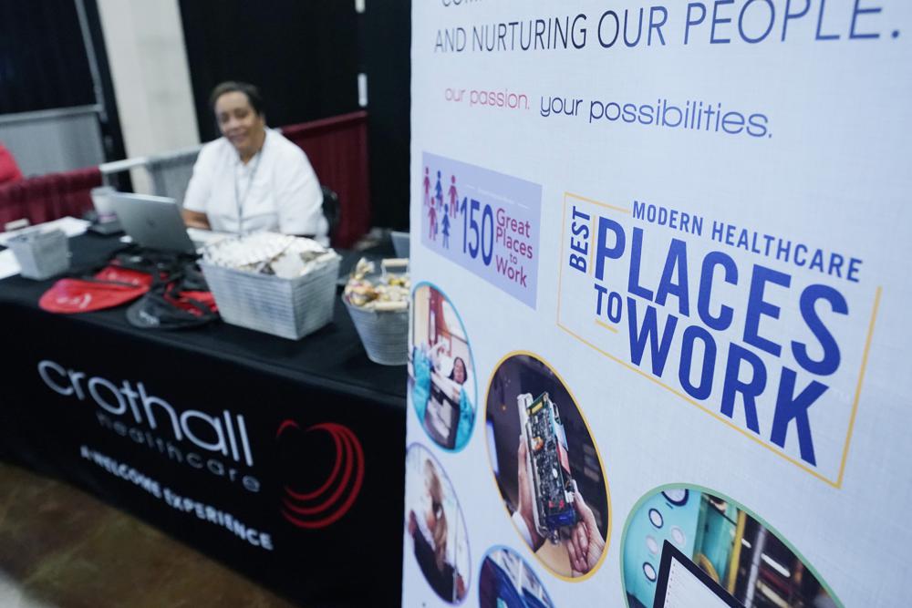 Employers manned booths with banners promoting their companies benefits, free logo branded swag and listed salary pay scales and in some cases recruitment bonuses in order to entice job applicants to approach their booths during the Lee County Area Job Fair in Tupelo, Miss., Tuesday, Oct. 12, 2021.  The number of Americans collecting unemployment benefits fell to a 52-year low after another decline in jobless aid applications last week. Jobless claims fell by 17,000, from 249,000 to 232,000 for the week ending Feb. 19, the Labor Department reported Thursday, Feb. 24, 2022.  (AP Photo/Rogelio V. Solis)