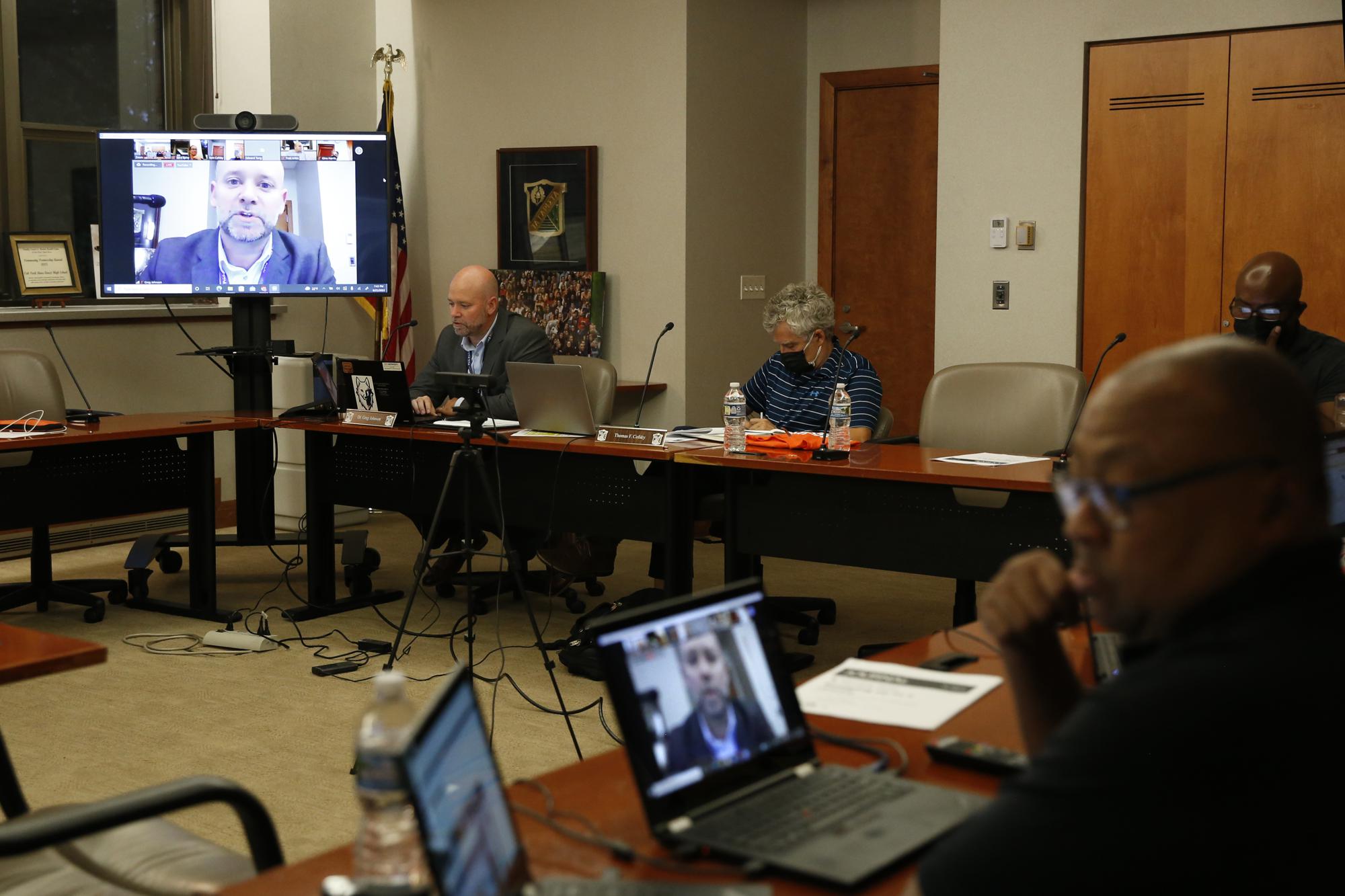 Greg Johnson, superintendent of the district that oversees Oak Park and River Forest High School, speaks at a school board meeting on Thursday, Aug. 25, 2022, in Oak Park, Ill. In 2020, shortly after Minneapolis police killed George Floyd, the school board voted 6-1 to remove a police officer from the school. As the school has tightened security, due to concerning incidents, Johnson is now working with the Oak Park police to come up with an agreement that would strengthen its ties with the school. (AP Photo/Martha Irvine)
