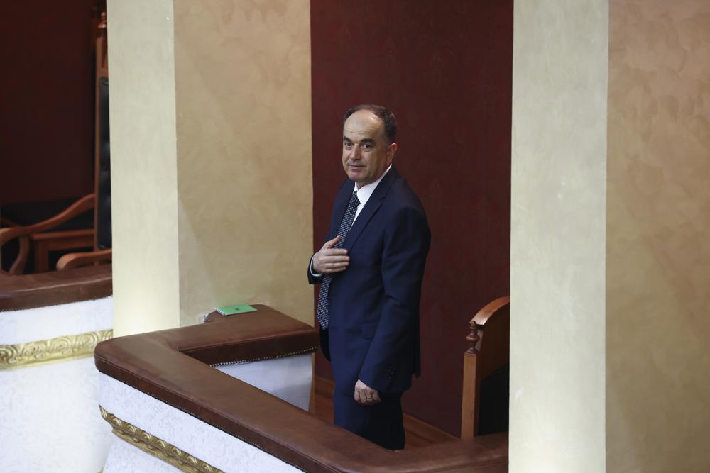 Gen. Maj. Bajram Begaj salutes the members of the Parliament after being elected as president, in the Parliament, in Tirana, Albania, Saturday, June 4, 2022. (AP Photo/Franc Zhurda)