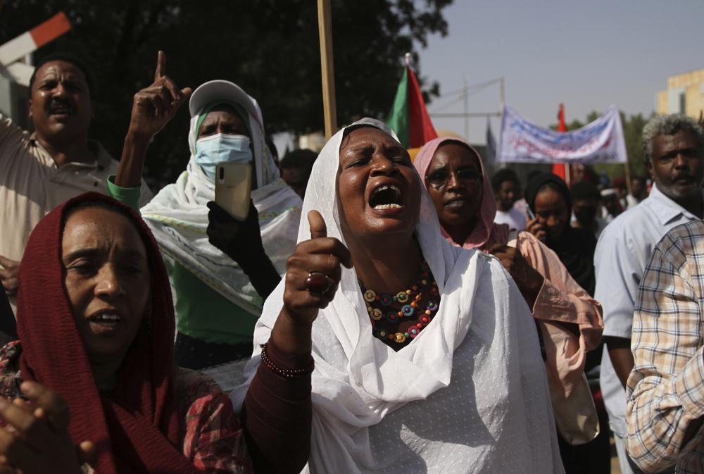 Sudanese participate in a demonstration, in Khartoum, Sudan, Thursday, Sept. 30, 2021. Thousands of Sudanese  rallied in the capital of Khartoum against the country's military and demanding the formation of new transitional authorities that would exclusively consist of civilians. Thursday's demonstration accused the generals of derailing the country’s transition to democracy. (AP Photo/Marwan Ali)