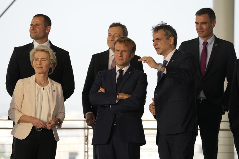 Greek Prime Minister Kyriakos Mitsotakis, right, shows the view of the Greek capital to French President Emmanuel Macron, center, European Commission President Ursula von der Leyen, left, Maltese Prime Minister Robert Abela, left background, Italian Prime Minister Mario Draghi, center background, and Spanish Prime Minister Pedro Sanchez during the EUMED 9 summit at the Stavros Niarchos Foundation Cultural Center in Athens, Friday, Sept. 17, 2021. Nine European countries on the Mediterranean are holding a summit in Athens to discuss issues ranging from climate change and the pandemic response to migration and Afghanistan. (AP Photo/Thanassis Stavrakis)