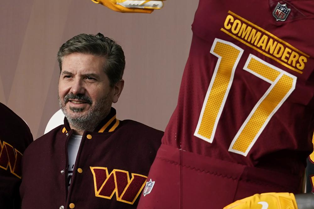 FILE - Washington Commanders' Dan Snyder poses for photos during an event to unveil the NFL football team's new identity, Feb. 2, 2022, in Landover, Md. Snyder and his organization are the subject of multiple ongoing investigations over workplace misconduct and potential financial improprieties. The D.C. attorney general opened an investigation into the team around the time the U.S. House Committee for Oversight and Reform referred its case to the Federal Trade Commission. (AP Photo/Patrick Semansky, File)