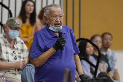 Donald Neconie, 84, a former U.S. Marine and member of the Kiowa Tribe, recounts his experiences as a child at an Indian boarding school Saturday, July 9, 2022, in Anadarko, Okla., during a meeting to hear about the painful experiences of Native Americans who were sent to government-backed boarding schools designed to strip them of their cultural identities. One by one, Native American tribal elders who were once students at government-backed Indian boarding schools testified about the hardships they endured: beatings, whippings, sexual assaults, forced haircuts and painful nicknames. (AP Photo/Sue Ogrocki)