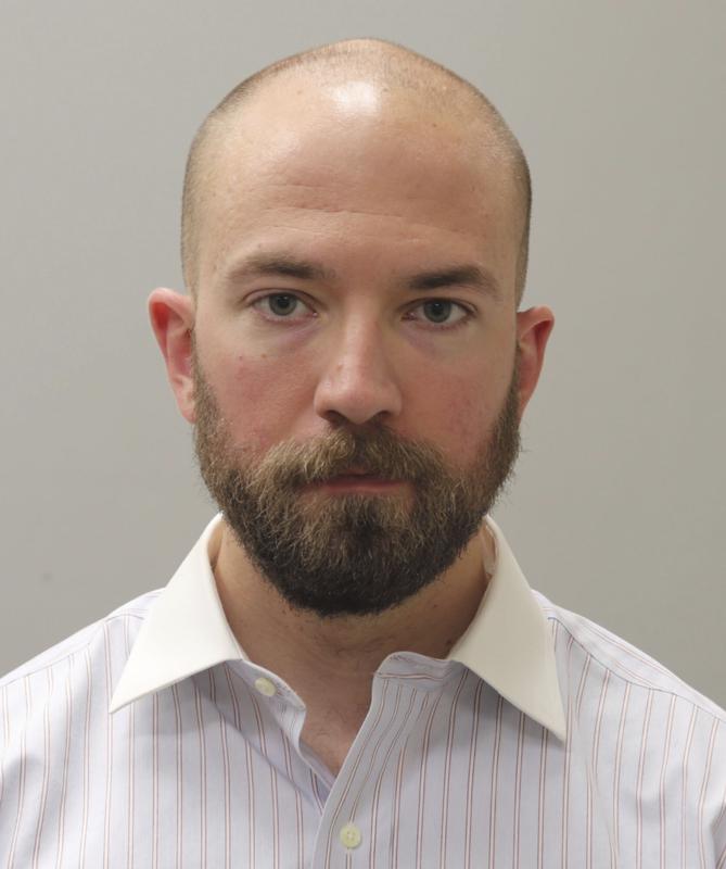 FILE - This booking photograph from Friday, May 7, 2021, shows Huntsville, Ala., police officer William Darby, who was convicted of murder in a fatal shooting that happened in 2018.   Darby resigned on Friday, July 23, after being paid by the city for more than two months after his murder conviction.(Madison County Sheriff's Office via AP, File)