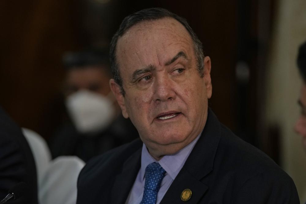 FILE - Guatemalan President Alejandro Giammattei meets U.S. Secretary of Homeland Security Alejandro Mayorkas at the Presidential House offices in Guatemala City, Tuesday, July 6, 2021. Guatemala has hired on Jan. 13, 2022, for $900,000 a major supporter of former President Donald Trump to seek influence with U.S. officials in an unusual lobbying contract paid for by its ally Taiwan, foreign lobby records show. (AP Photo/Moises Castillo, File)