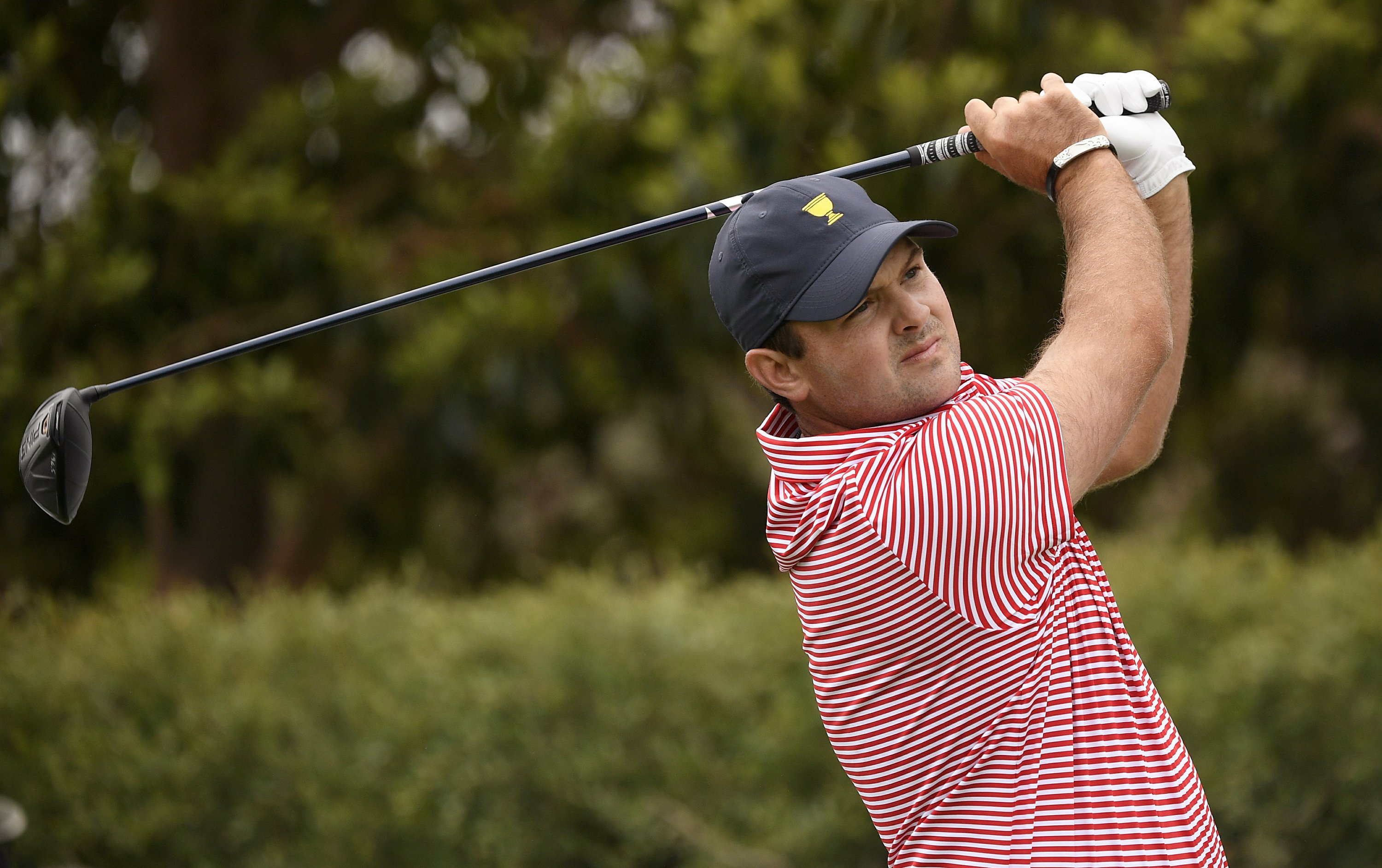 Patrick Reed hears the hecklers early at the Presidents Cup | AP News