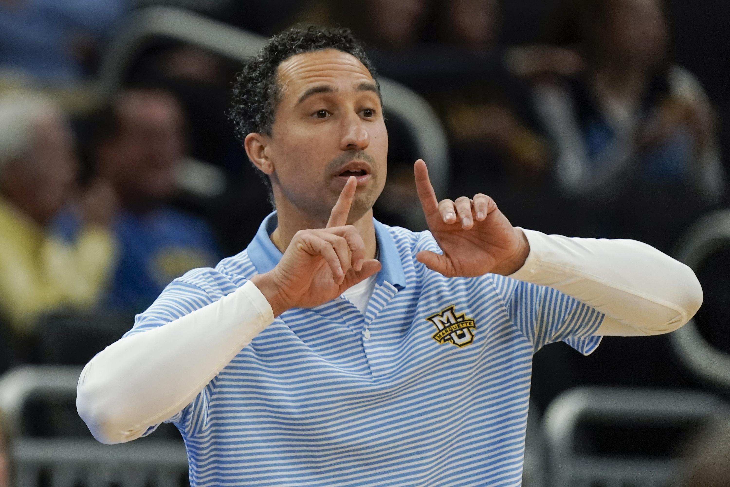 Marquette Golden Eagles coach Shaka Smart calls out a play to his team