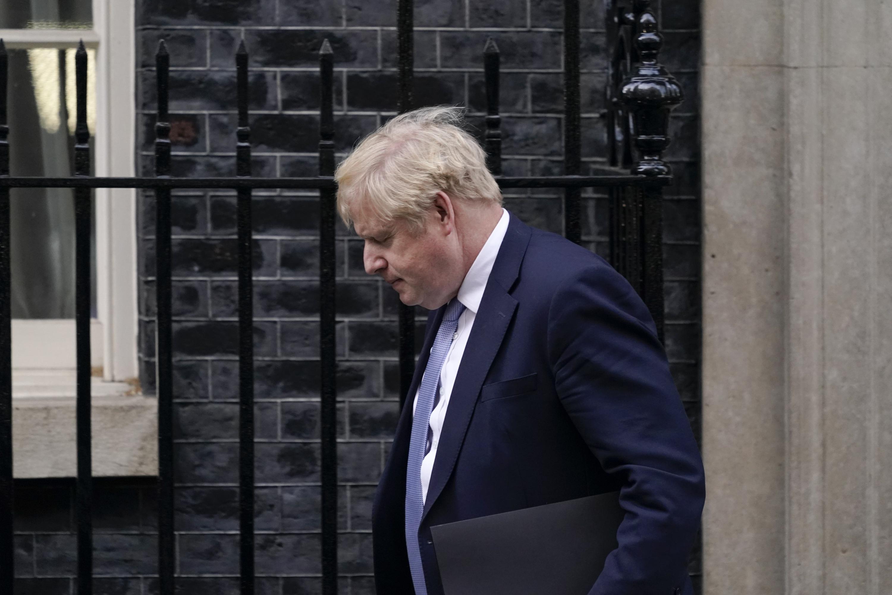 Boris Johnson says sorry after report slams lockdown parties - Associated Press