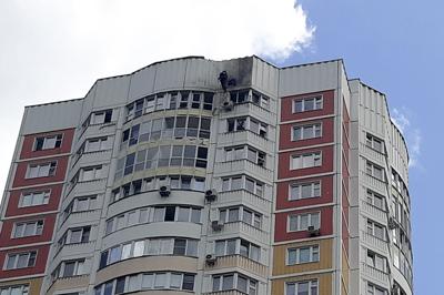 An investigator inspects a damage after a Ukrainian drone attacked an apartment building in Moscow, Russia, Tuesday, May 30, 2023. In Moscow, residents reported hearing explosions and Mayor Sergei Sobyanin later confirmed there had been a drone attack that he said caused "insignificant" damage. (AP Photo)