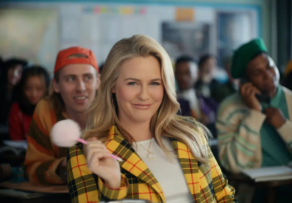 This photo provided by Rakuten Rewards shows Alicia Silverstone in a scene from Rakuten Rewards 2023 Super Bowl NFL football spot. Big name advertisers are paying as much as $7 million for a 30-second spot during the big game on Sunday, Feb. 12, 2023. In order to get as much as a return on investment for those million, most advertisers release their ads in the days ahead of the big game to get the most publicity for their spots. (Rakuten Rewards via AP)
