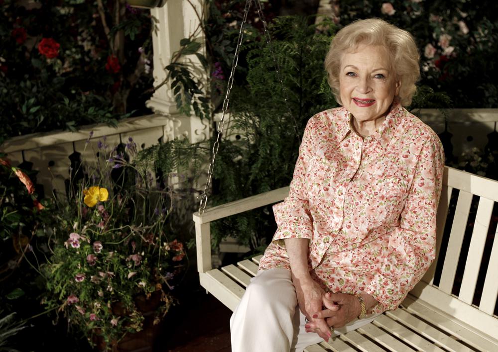 FILE - Actress Betty White poses for a portrait on the set of the television show "Hot in Cleveland" in Studio City section of Los Angeles on Wednesday, June 9, 2010.  Betty White, whose saucy, up-for-anything charm made her a television mainstay for more than 60 years, has died. She was 99.  (AP Photo/Matt Sayles, File)