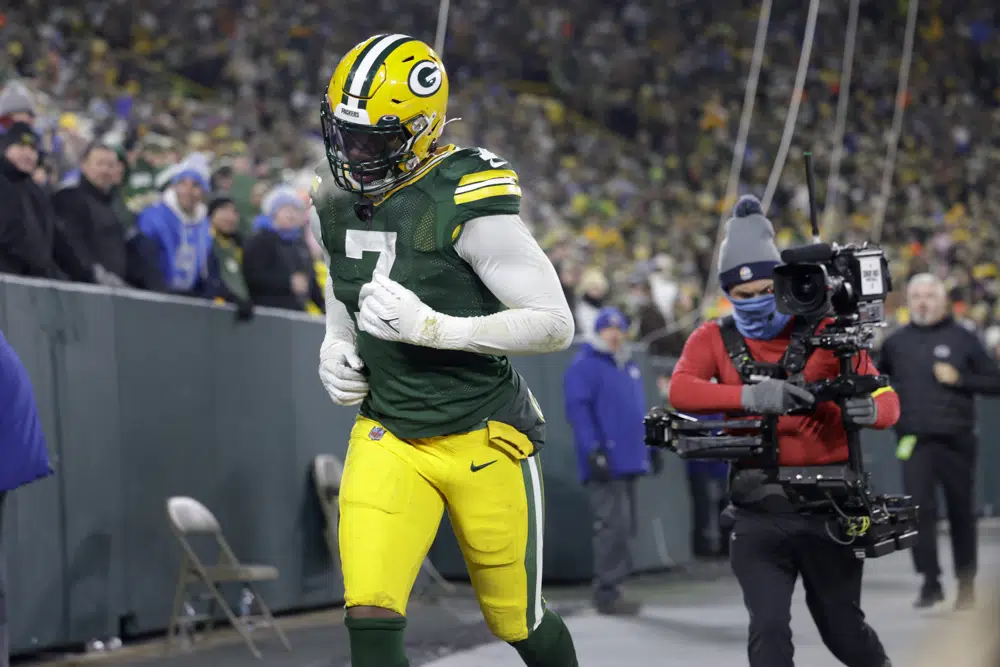 Green Bay Packers linebacker Quay Walker runs off the field after being ejected during the second half of an NFL football game against the Detroit Lions Sunday, Jan. 8, 2023, in Green Bay, Wis. (AP Photo/Matt Ludtke)