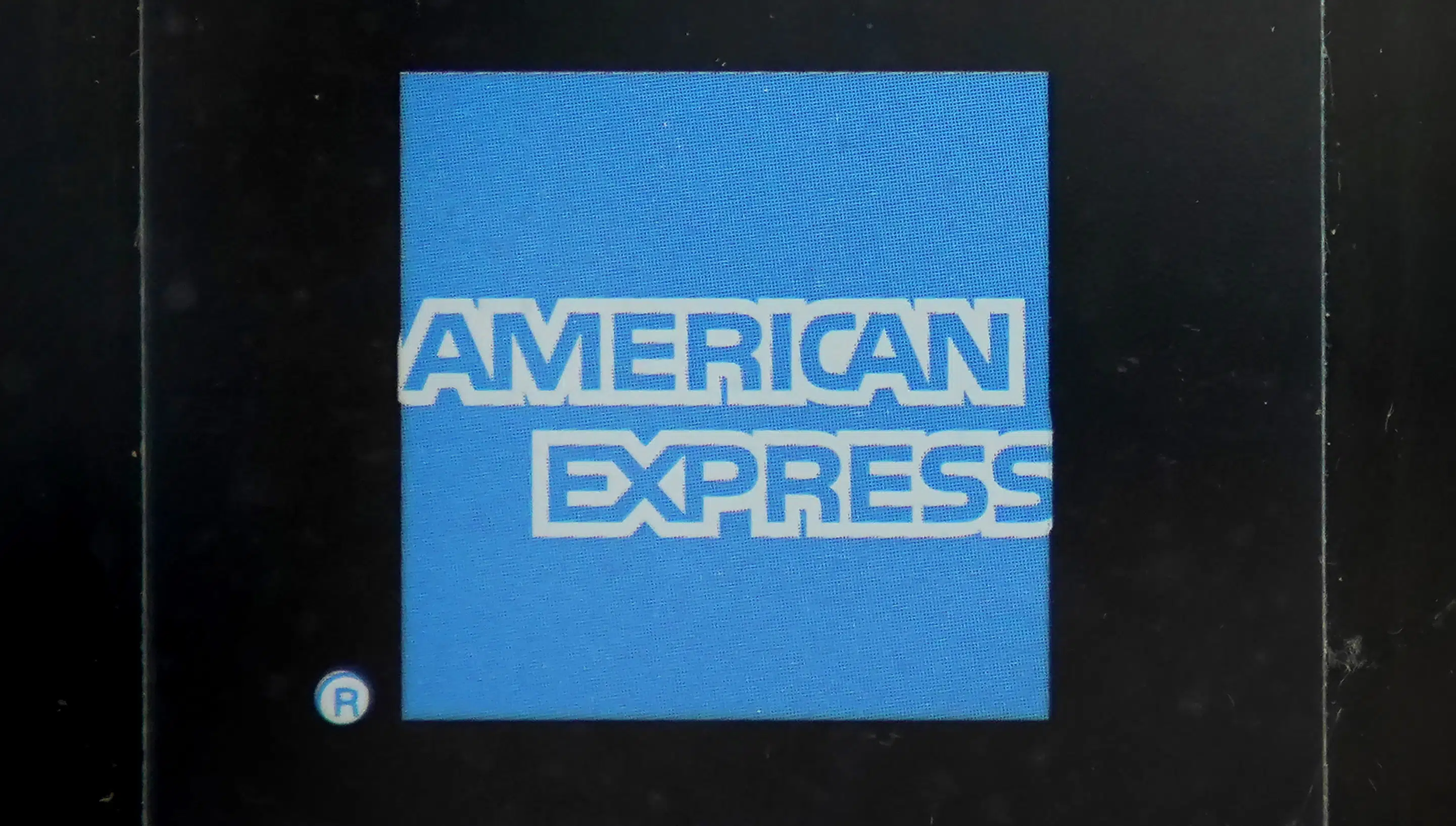 AmEx profits fall 9% as customers fall behind on payments | AP News