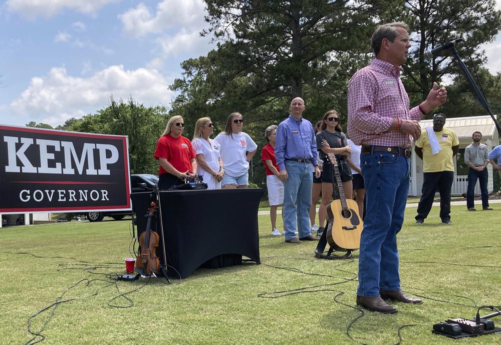 Georgia Gov. Brian Kemp speaks at a get-out-the-vote rally on Saturday, May 21, 2022, in Watkinsville, Ga.  Kemp is seeking to beat former U.S. Sen David Perdue and others in a Republican primary for governor on Tuesday, May 24. (AP Photo/Jeff Amy)