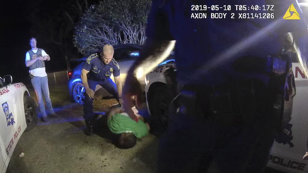 This image from video from Louisiana state trooper Lt. John Clary's body-worn camera shows trooper Kory York standing over Ronald Greene on his stomach on May 10, 2019, outside of Monroe, La. (Louisiana State Police via AP)