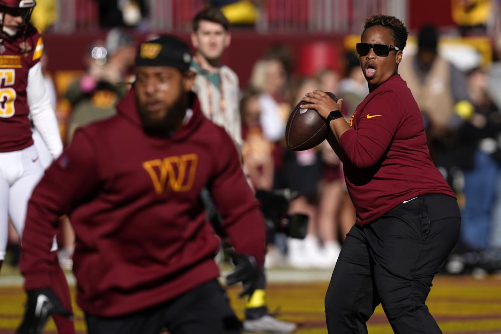 Washington Commanders assistant running backs coach Jennifer King conducts drills before an NFL football game against the Cleveland Browns, Sunday, Jan. 1, 2023, in Landover, Md. (AP Photo/Patrick Semansky)