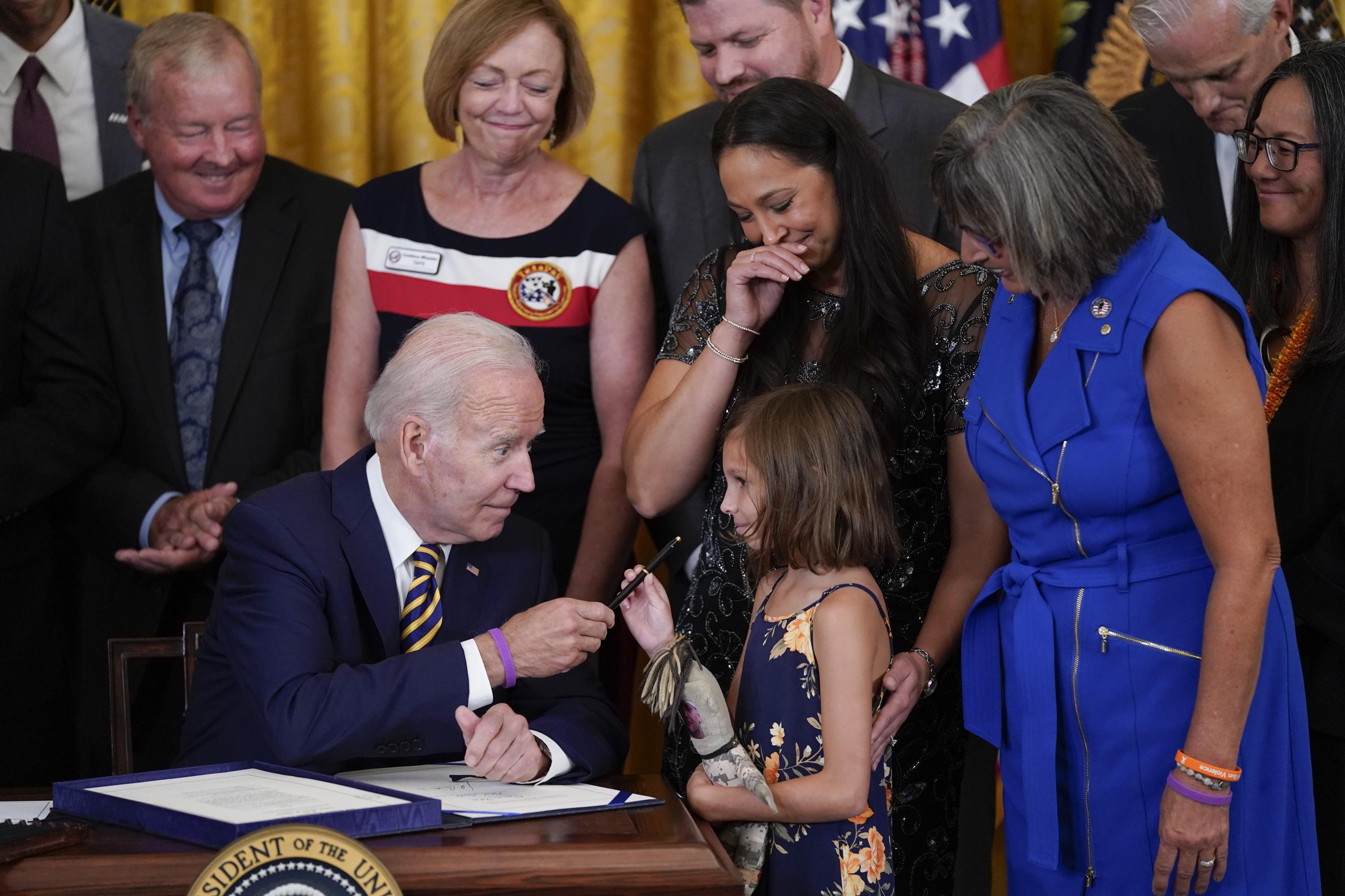 Biden signs 'burn pits' help for vets; a personal win, too AP News
