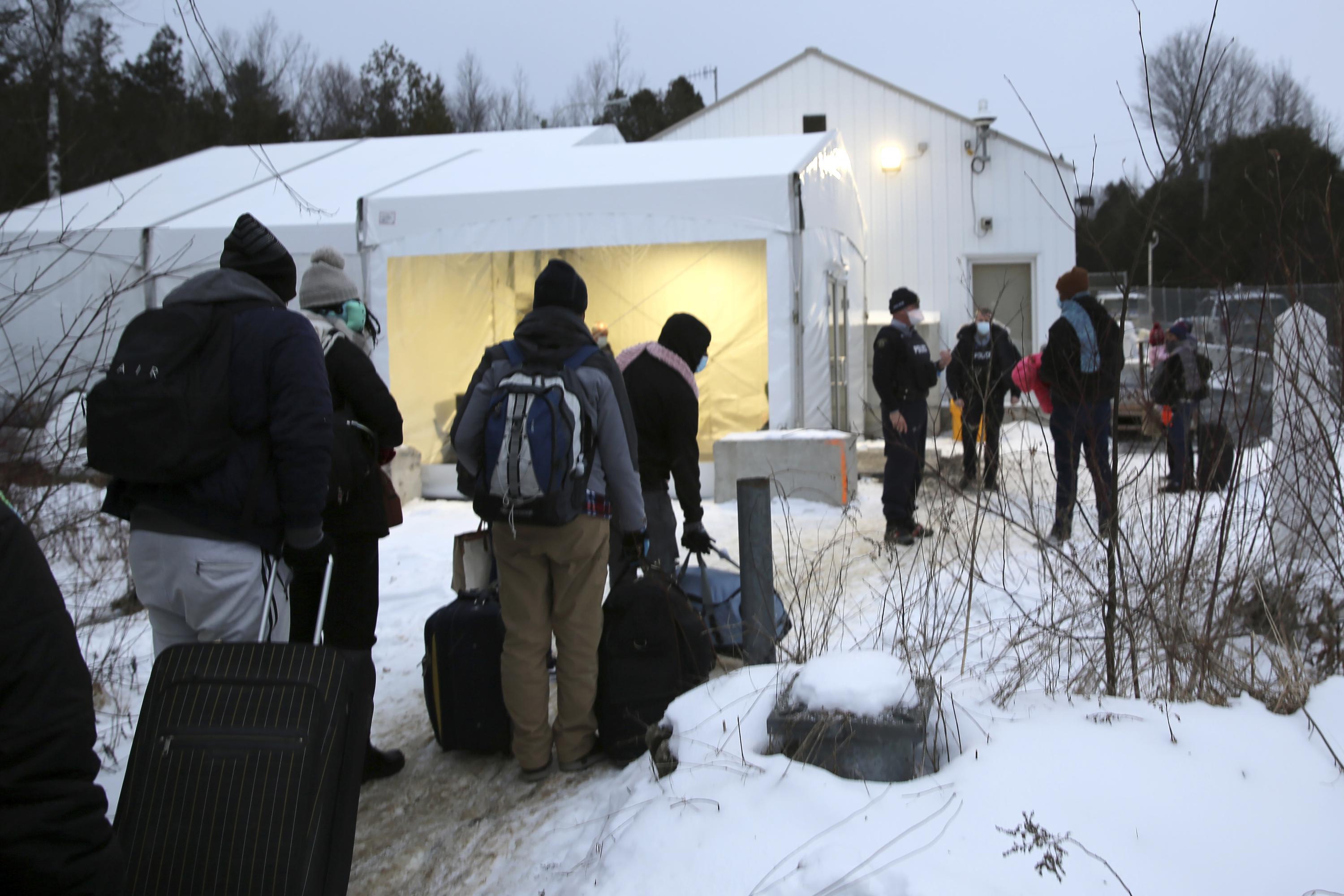More migrants seek asylum through reopened Canadian border AP News