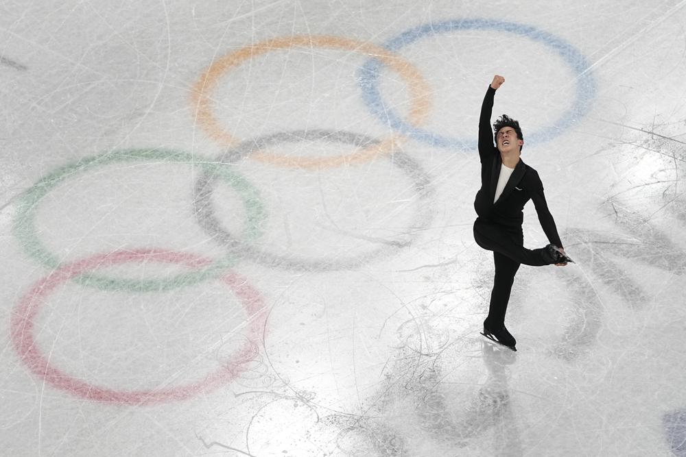 Nathan Chen, of the United States, competes during the men's short program figure skating competition at the 2022 Winter Olympics, Tuesday, Feb. 8, 2022, in Beijing. (AP Photo/Jeff Roberson)