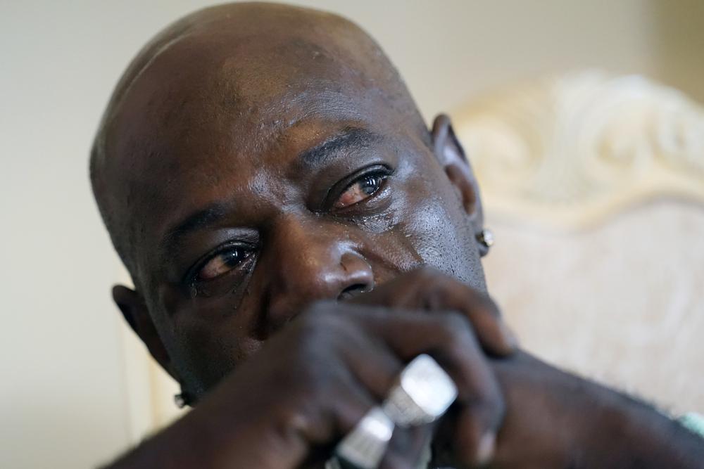 Aaron Larry Bowman cries during an interview at his attorney's office in Monroe, La., Thursday, Aug. 5, 2021, as he discusses his injuries resulting from a Louisiana State trooper pummeling him with a flashlight during a traffic stop in 2019. (AP Photo/Rogelio V. Solis)