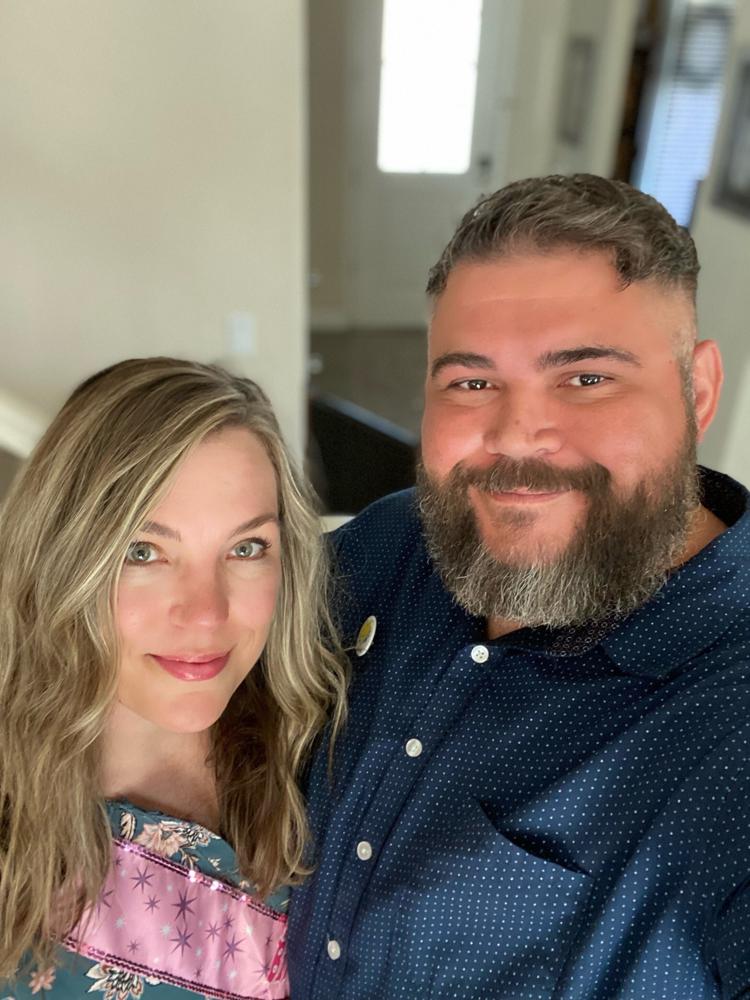 This photo shows Matt Escobar Sr. and his wife, Jessica Escobar, at home in Merced, Calif., on June 10, 2021. The two met in eighth grade and reconnected decades later after rekindling their childhood romance. (Matt Escobar Sr. via AP).