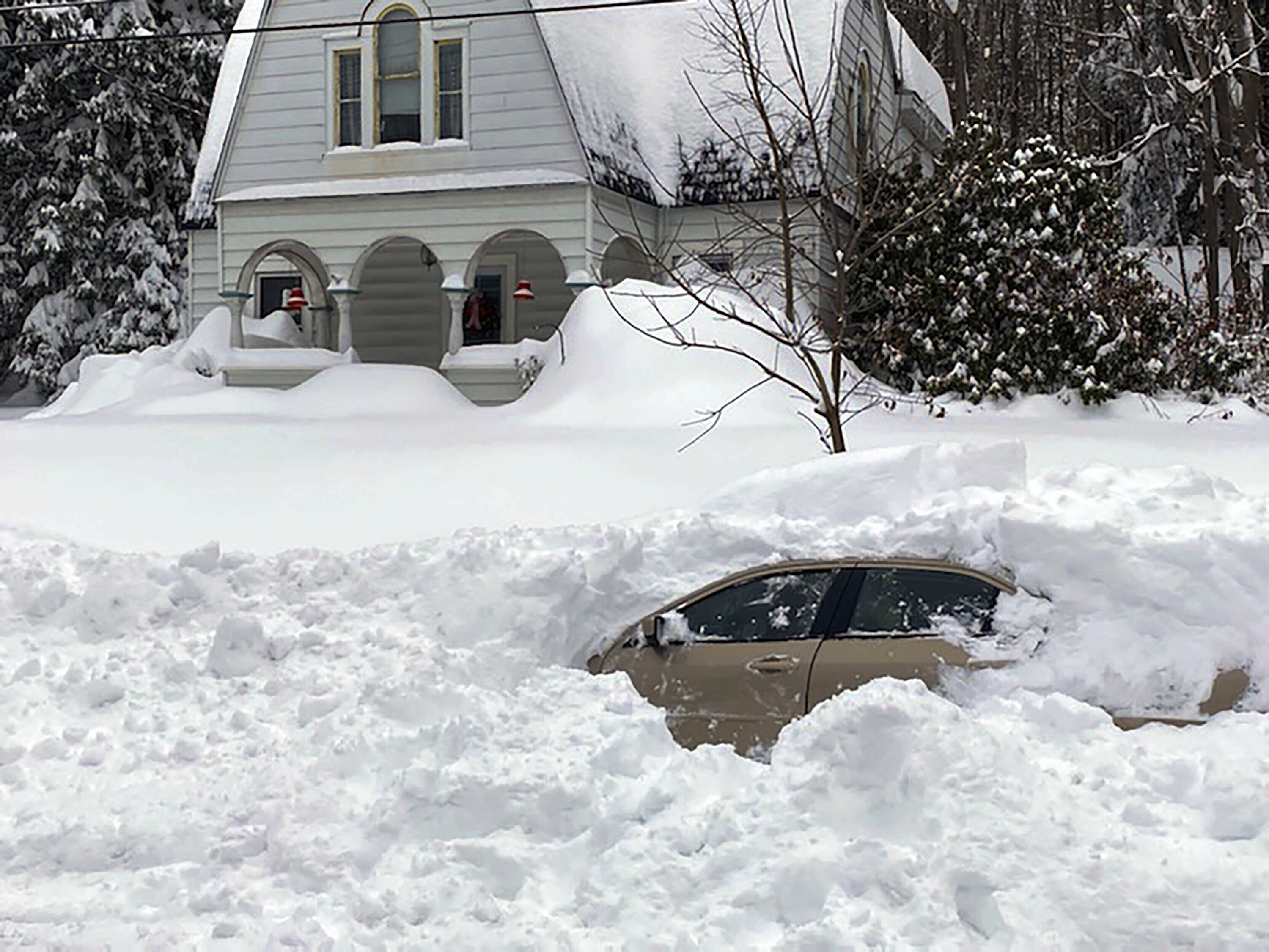 Motorist rescued after 10 hours buried in car by snow plow