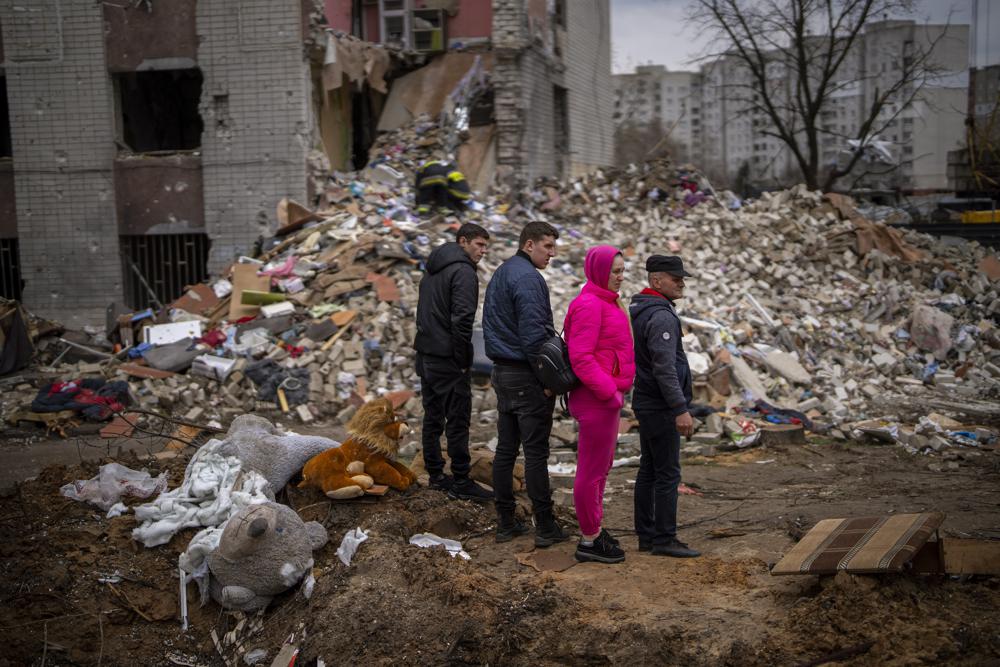 Residents look at their house destroyed by a Russian bomb in Chernihiv on Friday, April 22, 2022. (AP Photo/Emilio Morenatti)