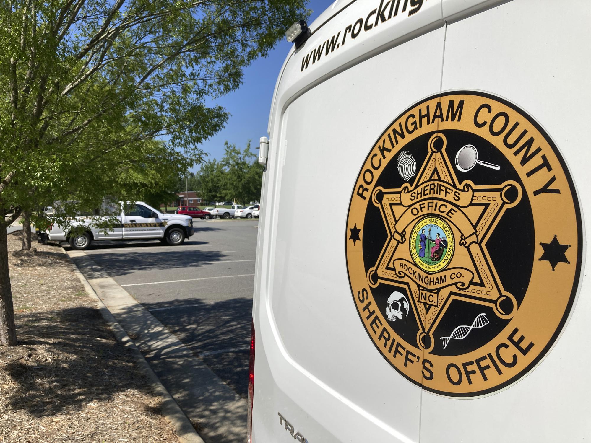 A crime scene unit van sits outside the Rockingham County Sheriff's Department in Wentworth, N.C., on Saturday, July 23, 2022. The rural county of just 91,000 residents subscribes to the powerful Fog Reveal service, which gives police the power to track cellphones, sometimes without a warrant. (AP Photo/Allen G. Breed)