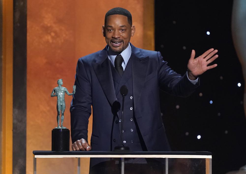 Will Smith accepts the award for outstanding performance by a male actor in a leading role for "King Richard" at the 28th annual Screen Actors Guild Awards at the Barker Hangar on Sunday, Feb. 27, 2022, in Santa Monica, Calif. (AP Photo/Chris Pizzello)