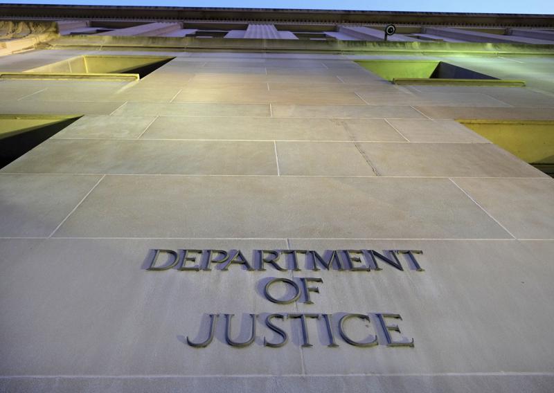FILE - In this May 14, 2013, file photo, the Department of Justice headquarters building in Washington is photographed early in the morning. The Justice Department said Monday, Aug. 9, 2021, that it would work toward providing families of 9/11 victims with more information about the run-up to the attacks as part of a federal lawsuit that aims to hold the Saudi government accountable. (AP Photo/J. David Ake, File)