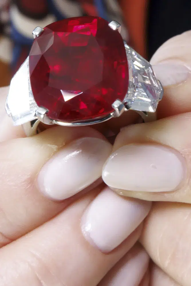 The 25.59 carat Sunrise Ruby and Diamond ring by Cartier, estimated between 14,000,000 - 18,000,000 CHF (Swiss Francs), is pictured, during a preview of "The World of Heidi Horten" the 700 piece jewellery collection of the late Austrian billionaire Heidi Horten, at Christie's Auction House in Geneva, Switzerland, Monday, May 8, 2023. (Salvatore Di Nolfi/Keystone via AP)