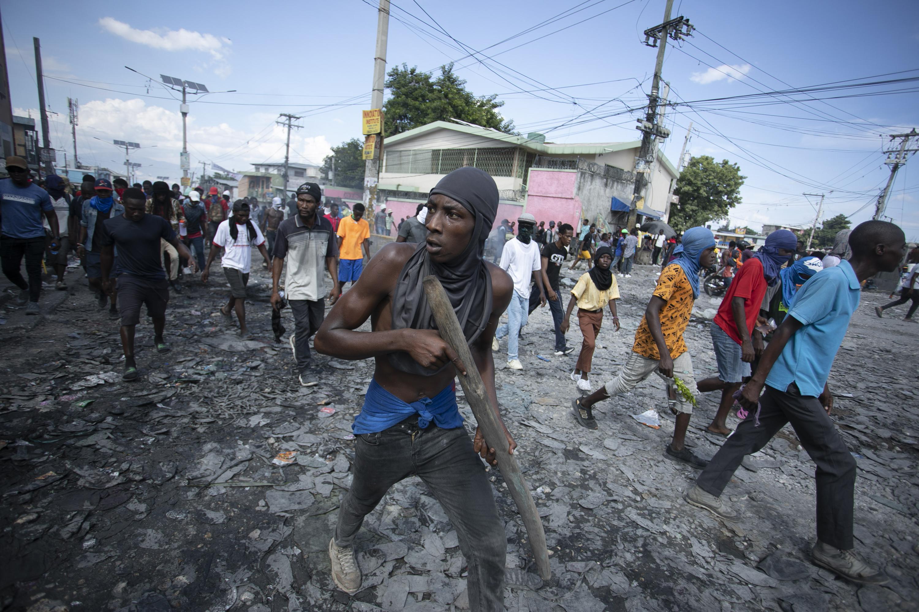 Calls for help, humanitarian corridor as gangs siege Haiti AP News