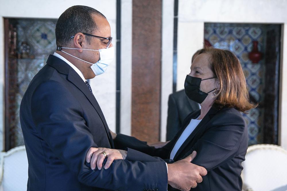 Tunisian Prime Minister Hichem Mechichi welcomes Italy's Interior Minister Luciana Lamorgese in Tunis, Thursday, May 20, 2021. Luciana Lamorgese and European Commissioner for Home Affairs Ylva Johansson are visiting Tunisia in the hope of striking a deal to reduce migrant sea-crossings. (AP Photo/Hassene Dridi)