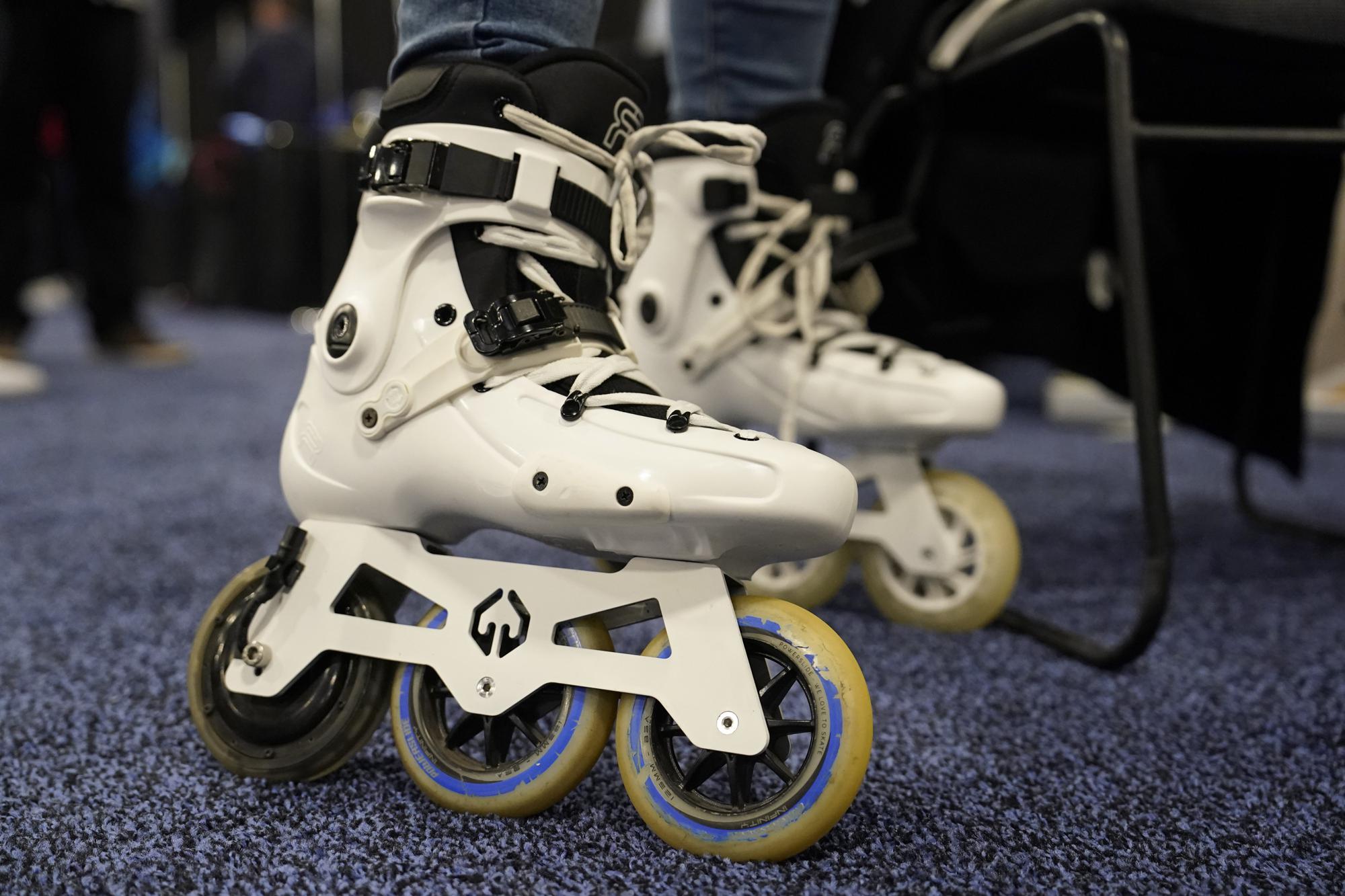 Mohamed Soliman of Atmos Gear shows off the Atmos Gear inline electric skates during CES Unveiled before the start of the CES tech show, Tuesday, Jan. 3, 2023, in Las Vegas. (AP Photo/John Locher)